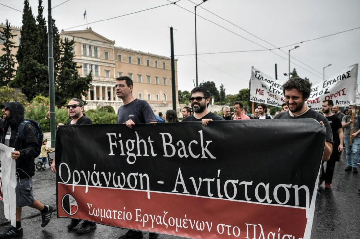 People demonstrate against a labour reform affecting unions proposed by the new conservative government