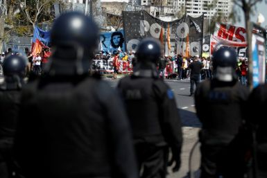Riot police face off against demonstrators in Buenos Aires, during a protest against the economic policies Argentine President Mauricio Macri. Argentina will hold presidential elections next October 27.