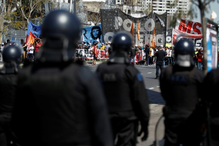 Riot police face off against demonstrators in Buenos Aires, during a protest against the economic policies Argentine President Mauricio Macri. Argentina will hold presidential elections next October 27.