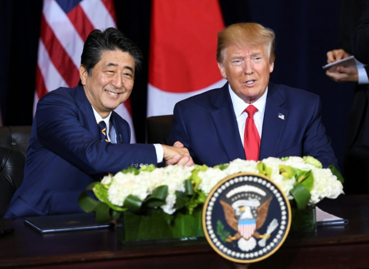 US President Donald Trump and Japanese Prime Minister Shinzo Abe shake hands after signing a trade agreement in New York, September 25, 2019, on the sidelines of the United Nations General Assembly
