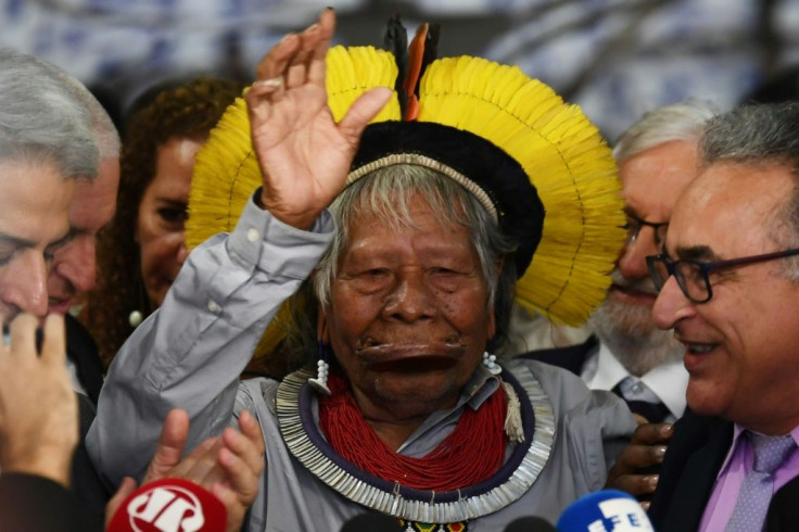 Brazilian indigenous leader Raoni Metuktire gestures during a press conference at the Brazilian Congress Lower House in Brasilia