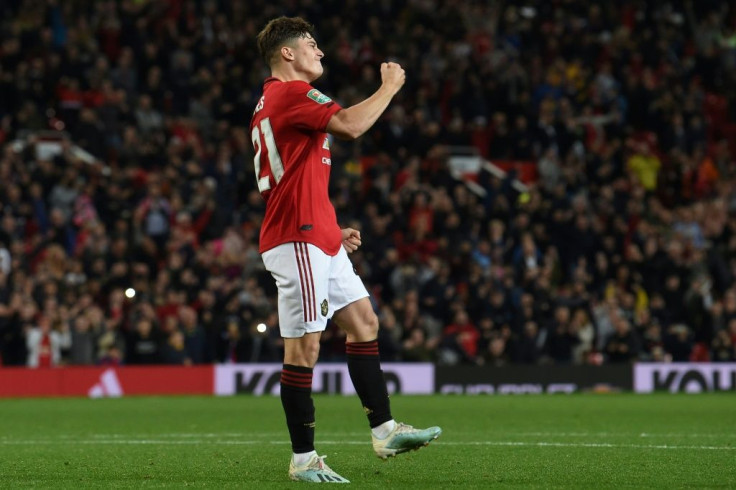 Manchester United midfielder Daniel James celebrates scoring the winning penalty against Rochdale