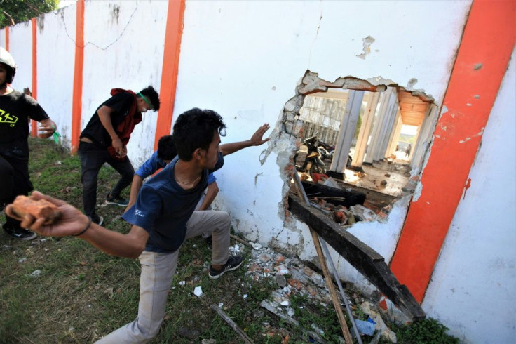 The death appeared to mark the first fatality in days of street battles across Indonesia