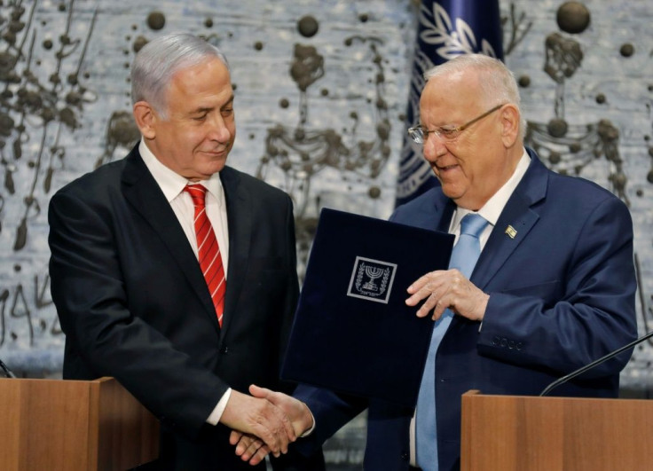 Israeli President Reuven Rivlin gives veteran incumbent Benjamin Netanyahu the potentially impossible task of forming a majority coalition while battling the looming threat of corruption charges