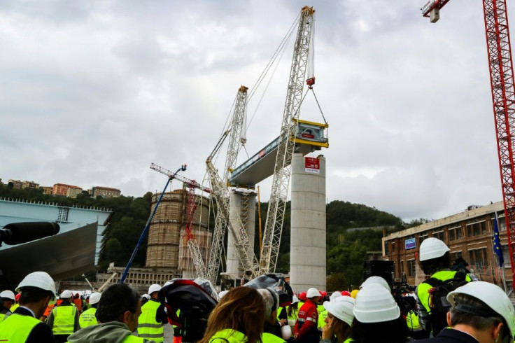 The first deck of Genoa's new bridge was lifted into position just over a year after the collapse that killed 43 people