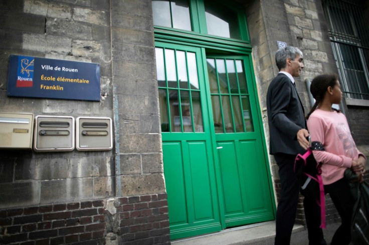 Parents of children at the Franklin elementary school in Rouen, northern France, on Tuesday were asked to come fetch the students because of a persistent oily smell after a huge fire at a chemicals plant in the city last week.