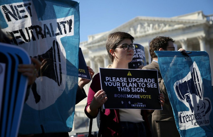 Proponents of "net neutrality" are seen at a 2018 rally as the Federal Communications Commission moved to roll back regulations aimed at treating all online traffic equally