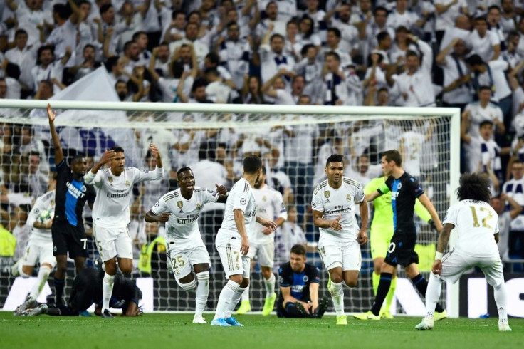 Real Madrid players celebrate after Casemiro scored to salvage a 2-2 draw against Club Brugge