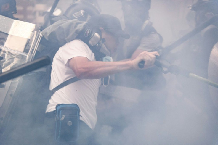 Violence coursed through Hong Kong on National Day, with dozens hurt and more than 150 people arrested