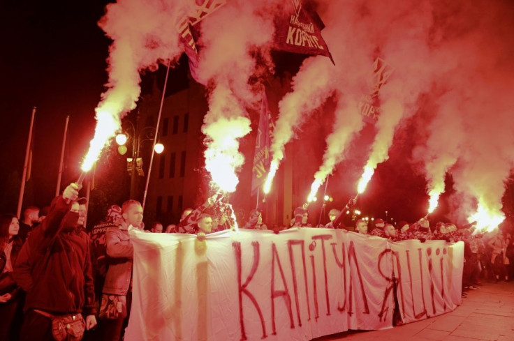Ukrainian activists urged "no to capitulationâ during a Tuesday protest in Kiev against a plan to give territory held by Russia-backed separatists a large degree of autonomy
