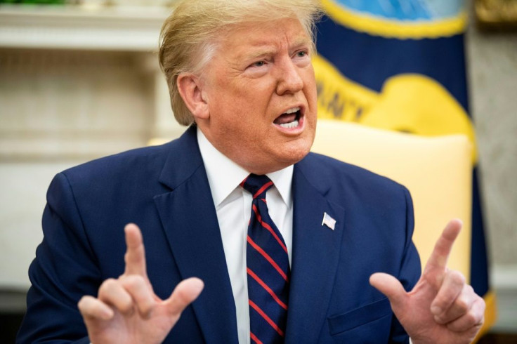 US President Donald Trump denounces the congressional impeachment investigation against him in comments to reporters during an Oval Office meeting with Finland's President Sauli Niinisto (not shown)