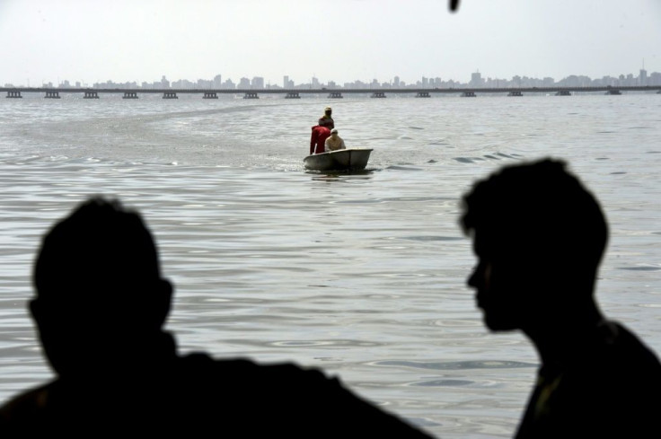 Residents return after fishing in the polluted waters of Lake Maracaibo, Venezuela, on June 13, 2019