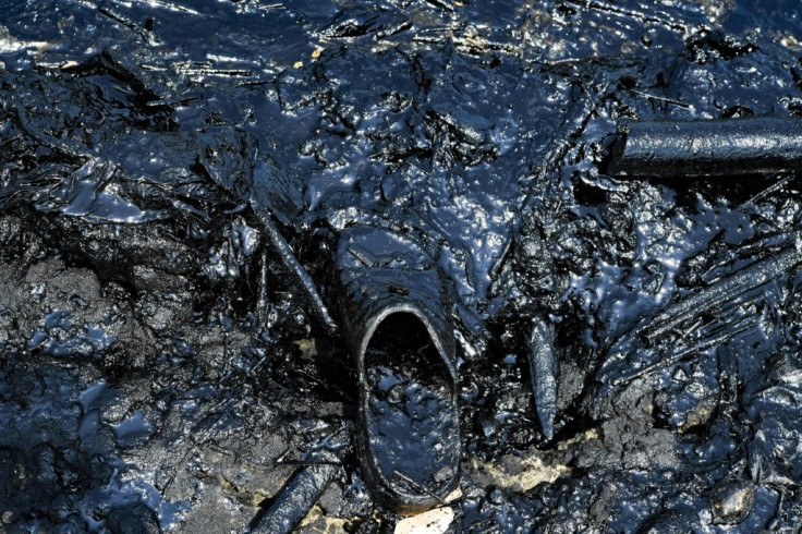 A sandal smeared with oil on the banks of Lake Maracaibo