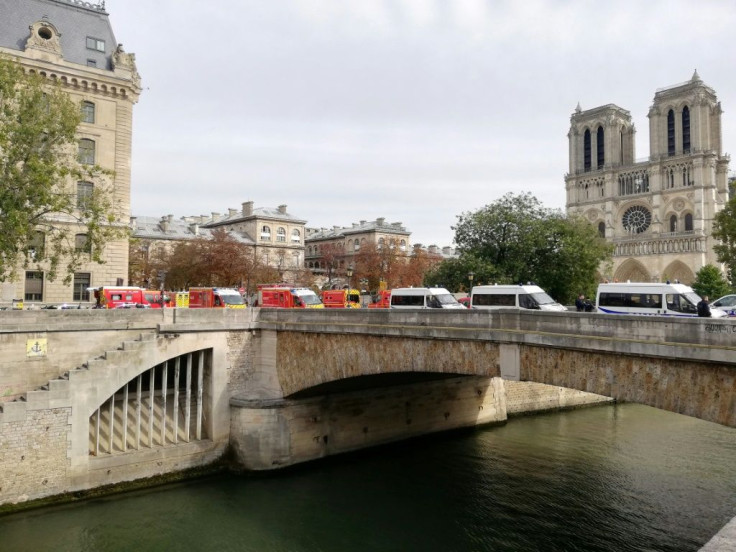 A man working at police headquarters in central Paris was shot dead after injuring two people there, sparking a major security alert