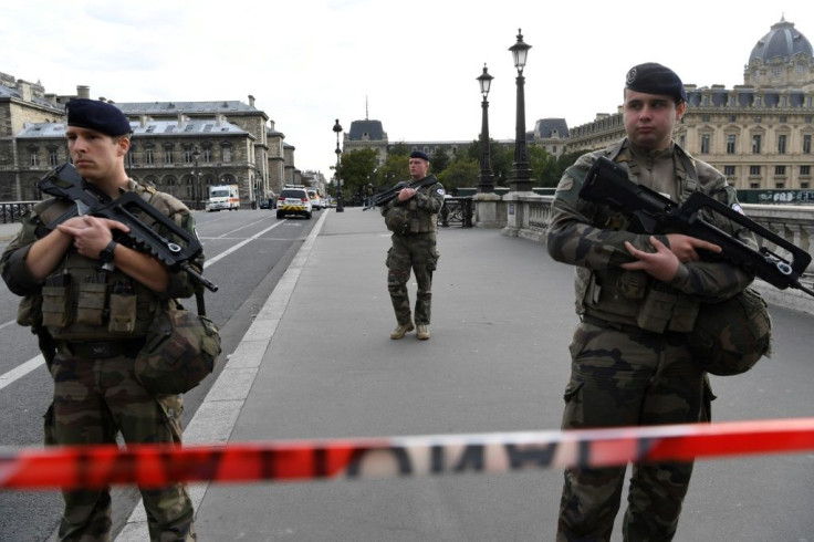 The police building was cordoned off after the lunchtime attack in the historic centre of Paris, near Notre-Dame cathedral