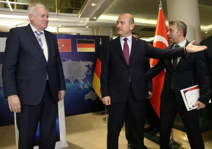 Turkey's Interior Minister Suleyman Soylu (R) and European Commissioner for Migration, Dimitris Avramopoulos meet to discuss cooperation on migration management in Ankara, Turkey, October 3, 2019