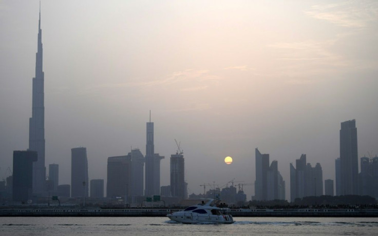 With the highest building in the world, Burj Khalifa (left), grand commercial centres and artificial islands, Dubai projects an image of prosperity