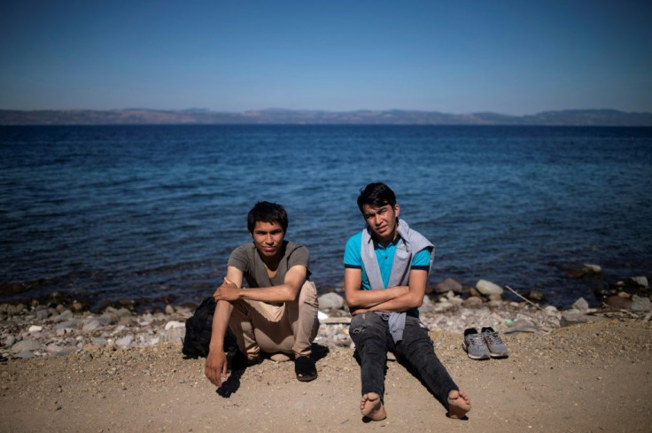 Greece has called on Turkey to "take responsibility" for a renewed wave of migrants to Greece; migrants rest on the Greek Mediterranean island of Lesbos on October 1, 2019, after crossing the Aegean Sea from Turkey in a dinghy