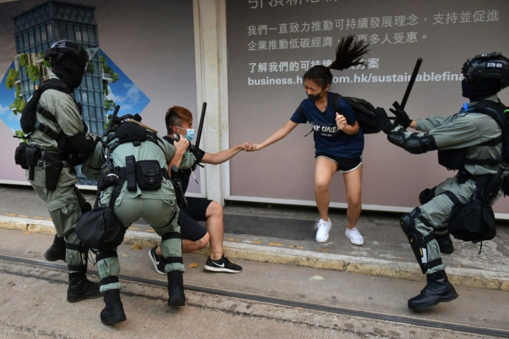 Hong Kong police questioned a couple wearing face masks