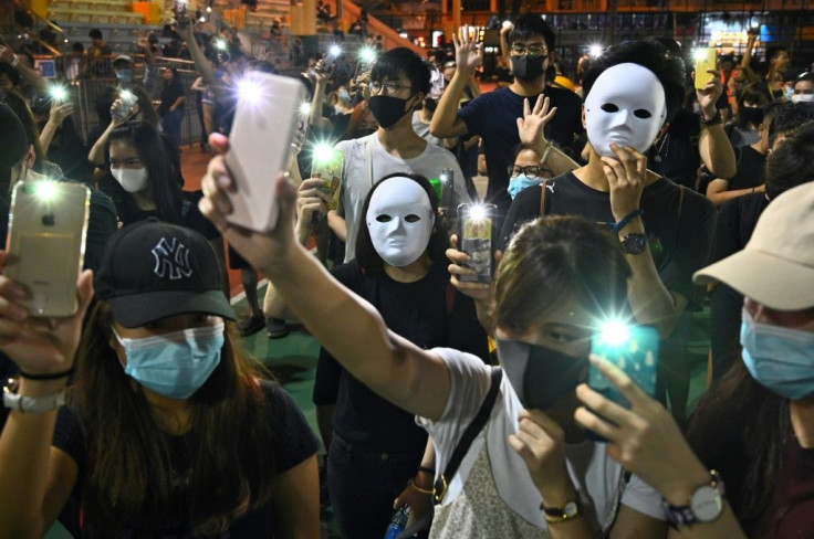 Thousands staged unsanctioned marches and flashmob protests at, a day after the city's leader outlawed face coverings at protests, invoking colonial-era emergency powers not used for half a century