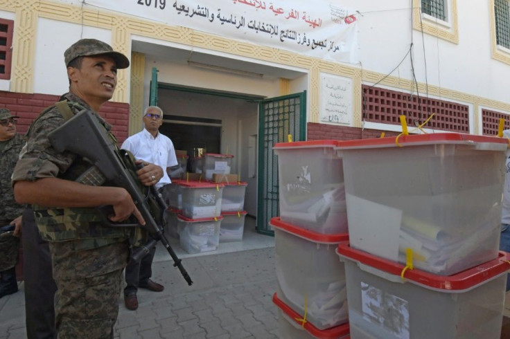 Tunisia's parliamentary election comes just before an October 13 two-way run-off in a presidential contest pitting a jailed business tycoon against a law professor