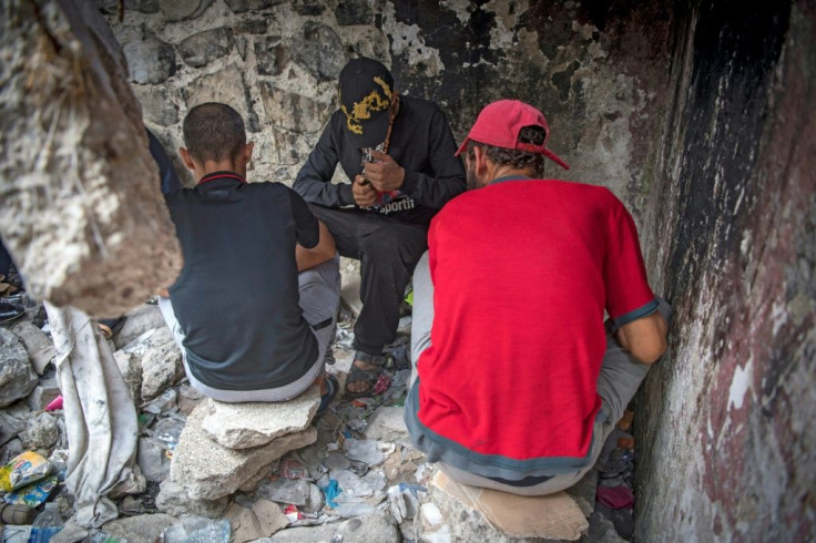 Moroccan addicts smoke heroin in a squat behind a police station in the Moroccan city of M'diq near Tetouan