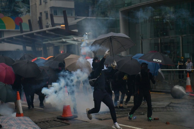 Hong Kong police fired tear gas at pro-democracy protesters after tens of thousands hit the streets once more