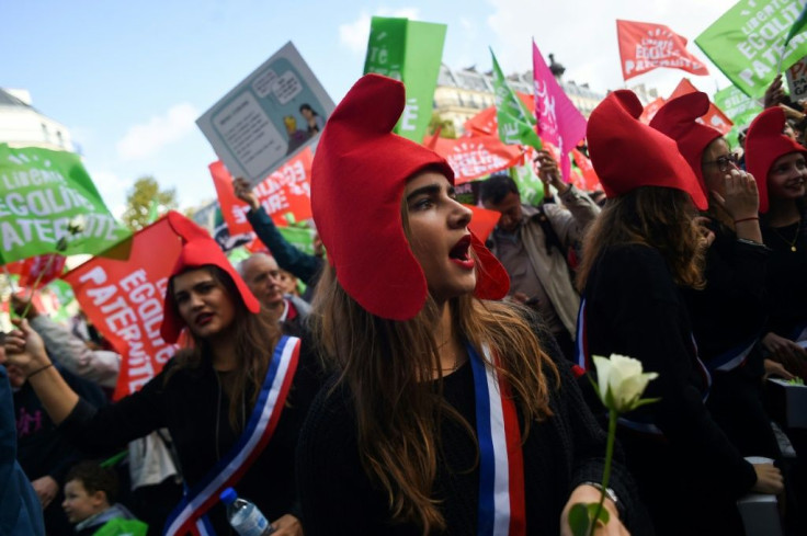 Many protesters wore the distinctive cone-shaped red Phyrgian hats that are a symbol of the French republic