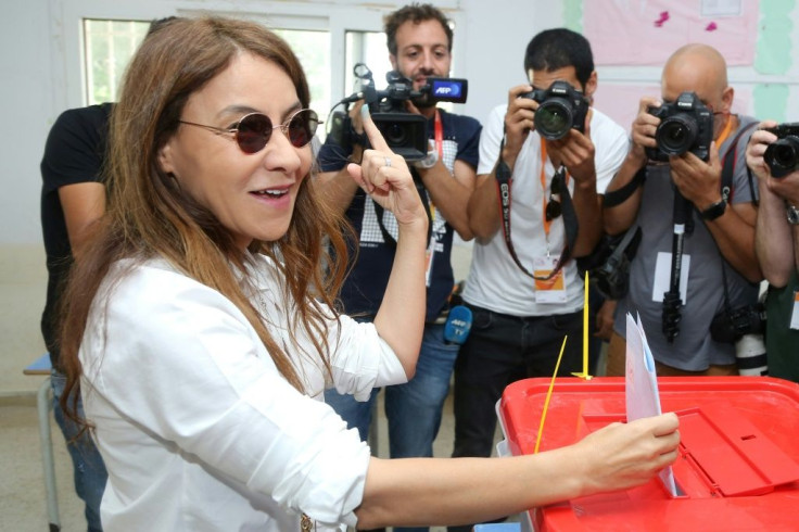 Salwa Smaoui, wife of jailed business tycoon and presidential candidate Nabil Karoui, casts her ballot at a polling station in the capital Tunis on October 6, 2019, during the third round of legislative elections since the 2011 Arab Spring revolt