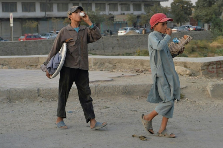Afghanistan's economy remains so weak that poor families often pull their kids from school and send them to hustle for extra cash, like these young Kabul street vendors