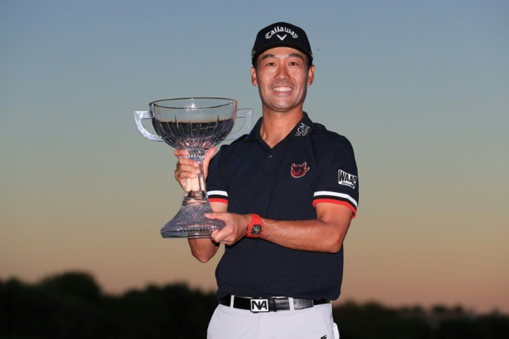 Korean-born American Kevin Na celebrates with the trophy after winning the US PGA Tour's Shriners Hospitals for Children Open at the second playoff hole in Las Vegas