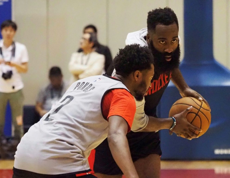 Houston Rockets guard James Harden (R) distanced himself from the controversy saying "We apologise. We love China"