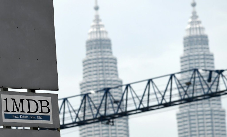 The fines are linked to a wide-ranging probe into billions of dollars that were looted from state investment fund 1MDB between 2009 and 2014