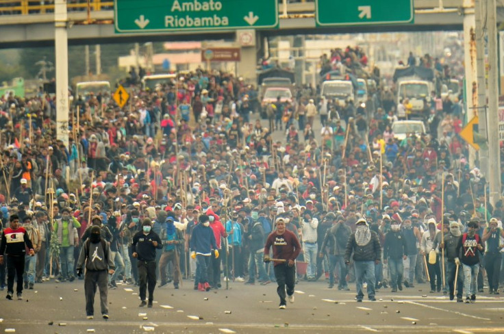 Indigenous people and farmers block a road in Machachi, on the outskirts of the capital Quito on October 7, 2019