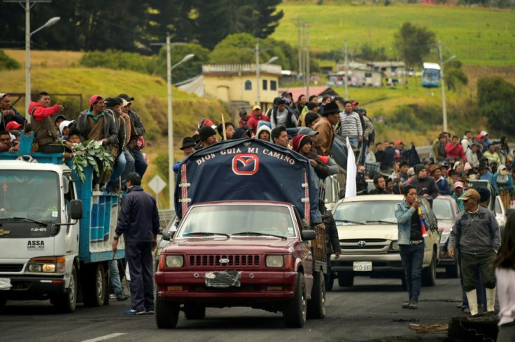 Indigenous people and farmers travel on trucks on their way to Quito in protest against the government's economic policies