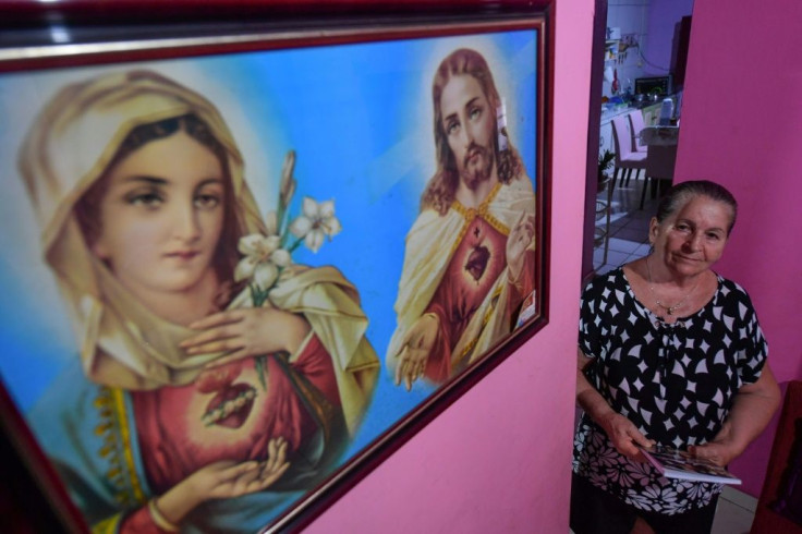 Maria Helena Locatelli -- seen in her house in Santarem in Brazil's Amazon region -- moved to the area in the early 1970s with the promise of a new life; instead, she and her family slept in a dirt shed