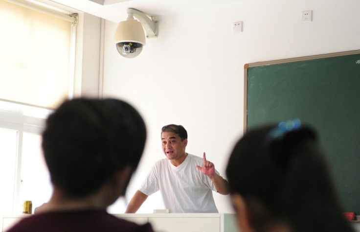 Ilham Tohti, a Uighur scholar imprisoned in China whom the European Parliament has put on its shortlist for the Sakharov Prize, lectures in a classroom in Beijing in 2010