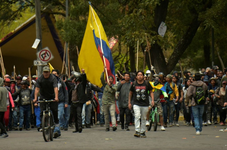 Demonstrators march into Quito to bring their protest against a sharp rise in fuel prices to the capital
