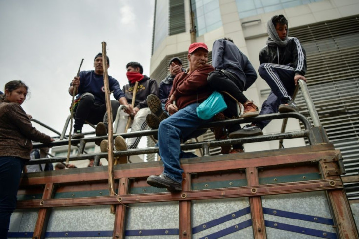 Indigenous people and peasants arrive in Quito following days of protests against the sharp rise in fuel prices sparked by the government's decision to scrap subsidies