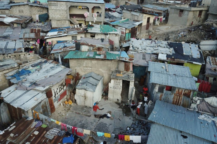 Haiti's rich-poor divide is vast -- in this neighborhood in Port-au-Prince, tiny cement-block homes and makeshift shelters fashioned from plastic and tarps line the narrow, trash-filled lanes