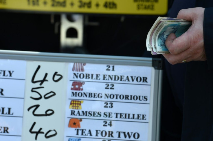 Odds are displayed at the Aintree Racecourse in Liverpool