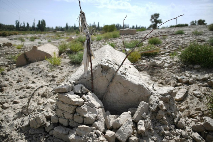 China is destroying burial grounds where generations of Uighur families have been laid to rest, leaving behind human bones and broken tombs in what activists call an effort to eradicate the ethnic group's identity in Xinjiang