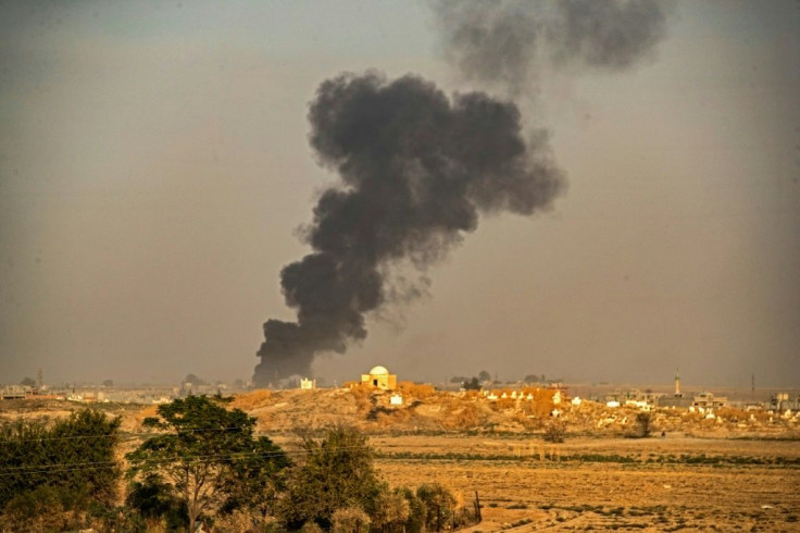 Smoke billows following Turkish bombardment on the town of Ras al-Ain in northeastern Syria
