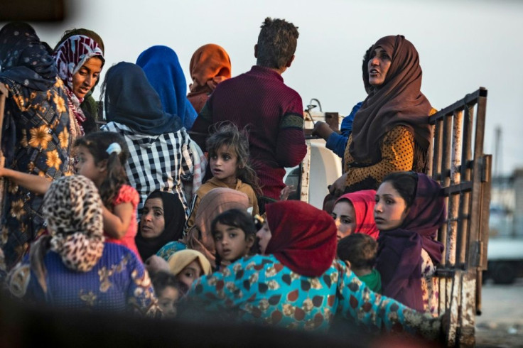Civilians flee amid Turkish bombardment of Syria's northeastern town of Ras al-Ain along the Turkish border