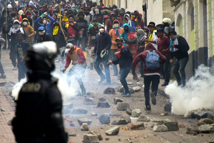Demonstrators clash with riot police in Quito, as thousands march against Ecuadorean President Lenin Moreno's decision to slash fuel subsidies
