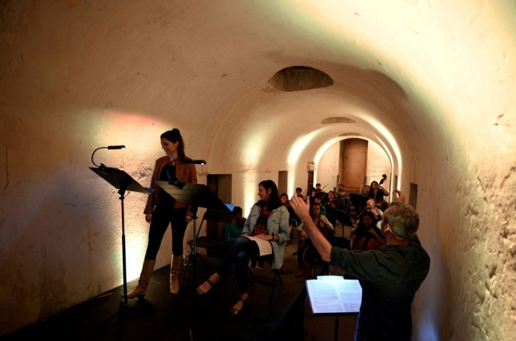 Eli Spindel conducts members of the String Orchestra of Brooklyn as they rehearse for a series held in the Green-Wood Cemetery catacombs, which are normally closed to the public
