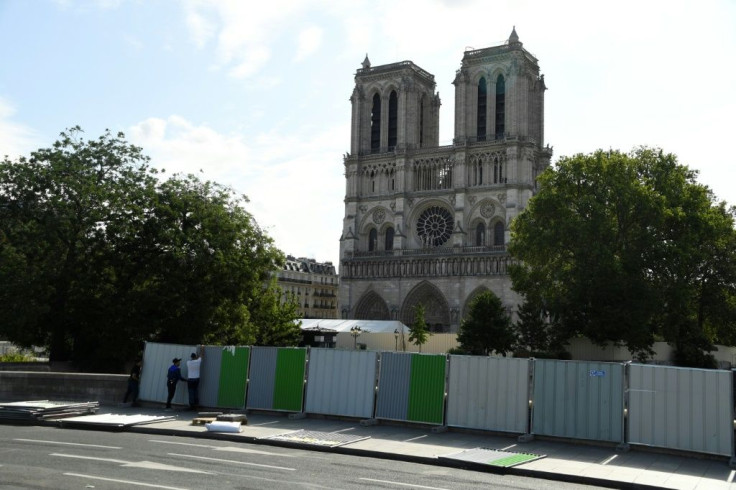 Workers installed fencing around Notre-Dame Cathedral in August as they began lead clean-up operations