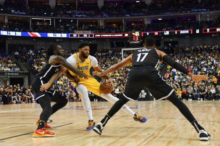 Under a heavy police presence, the NBA game in Shanghai got under way smoothly