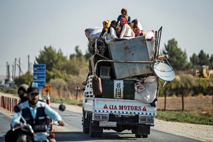 Civilians fled their homes in vehicles or on foot with their belongings