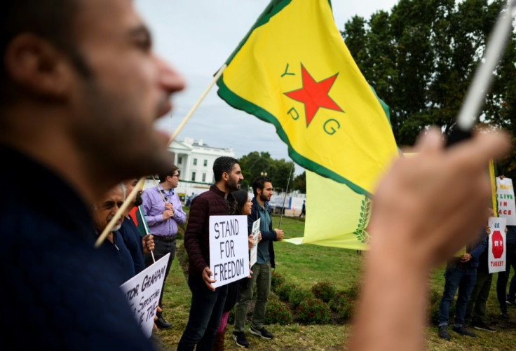 Protesters demonstrate against US President Donald Trump's Syria decision in front of the White House